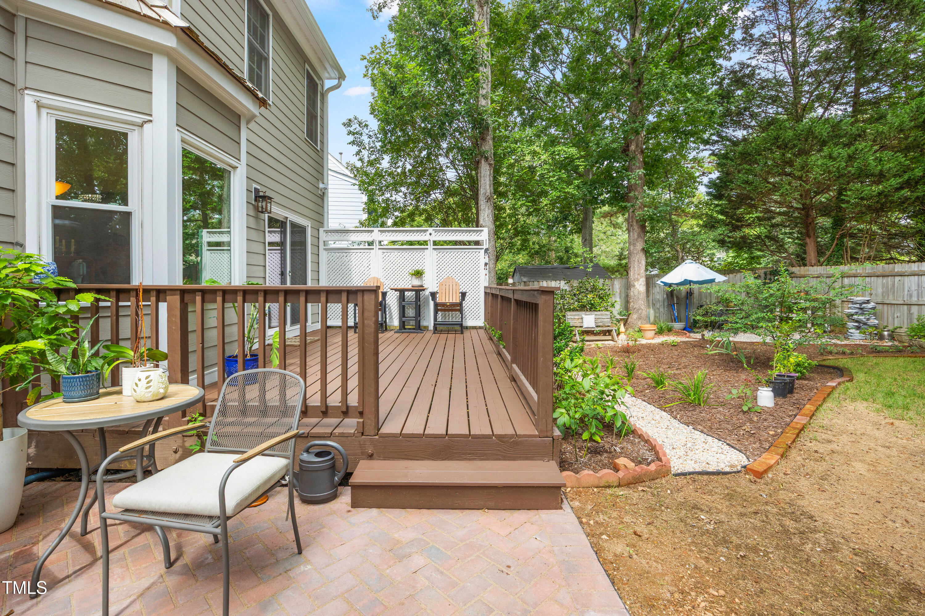207 Wintermist Drive Cary, NC 27513 - Photo 40 of 43 a view of a patio with a table and chairs