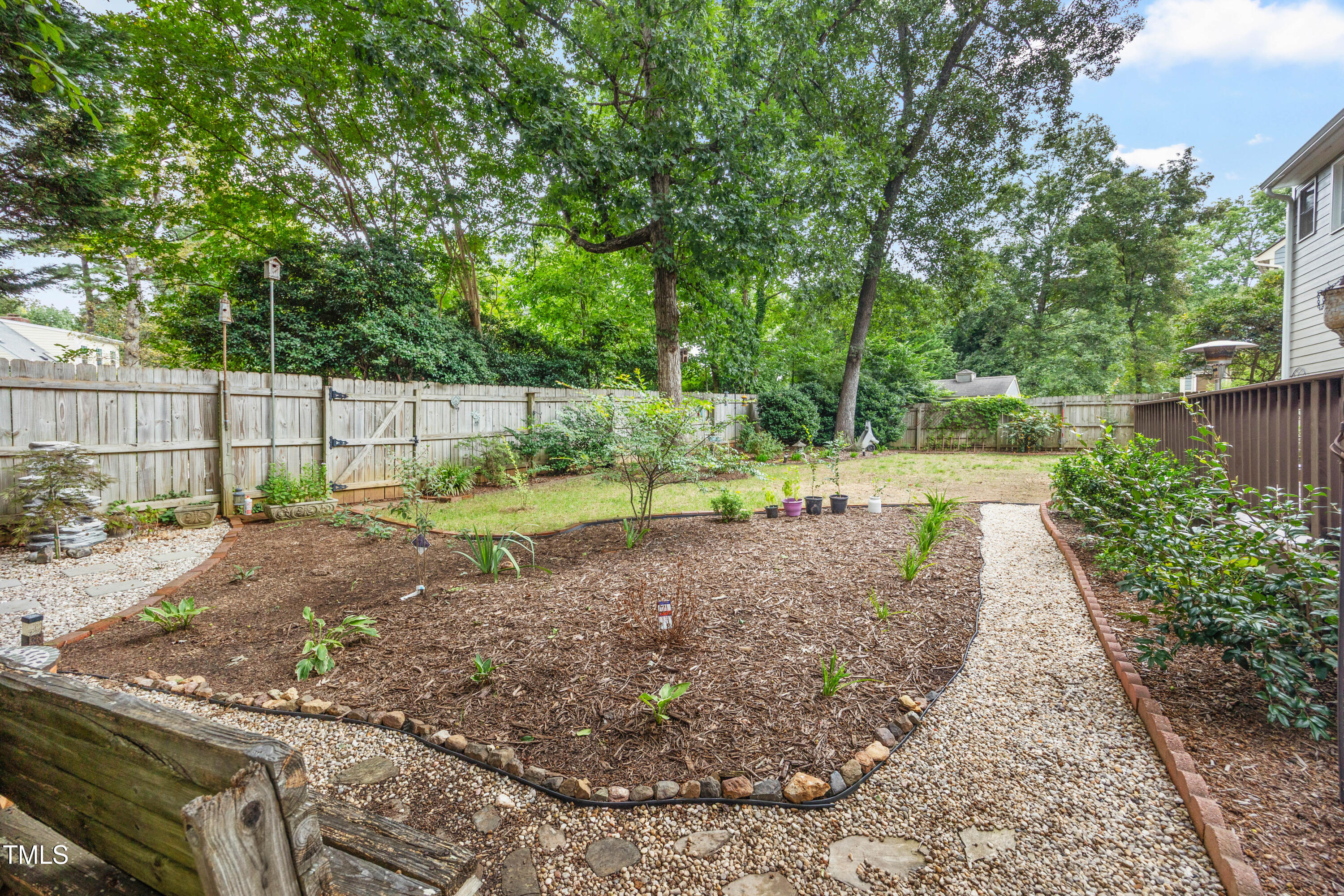 207 Wintermist Drive Cary, NC 27513 - Photo 41 of 43 a view of a backyard with large trees
