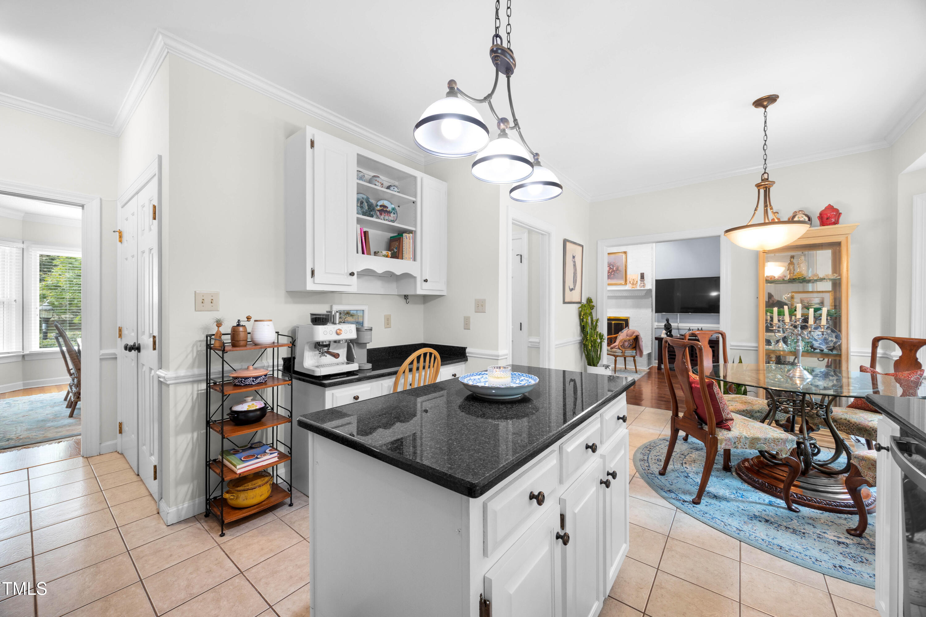 207 Wintermist Drive Cary, NC 27513 - Photo 7 of 43 a kitchen with stainless steel appliances granite countertop a stove and a sink