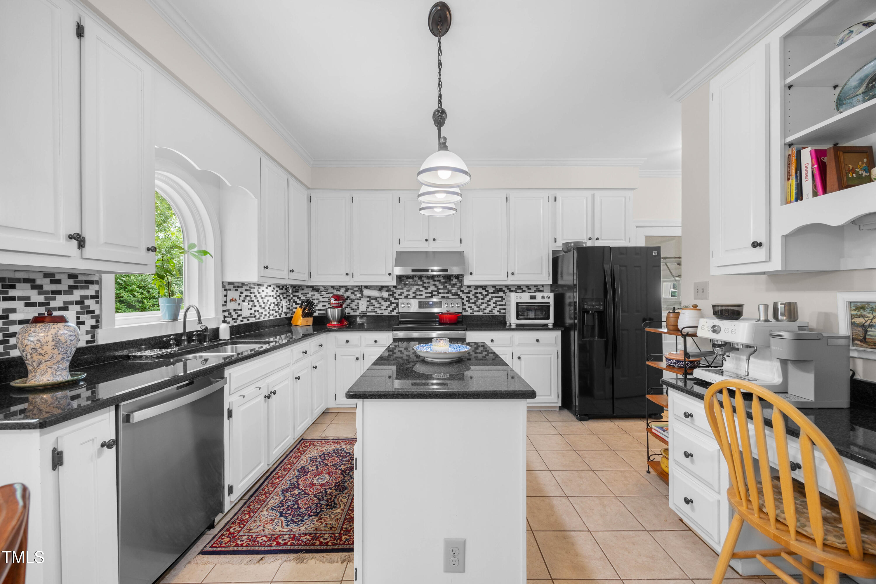 207 Wintermist Drive Cary, NC 27513 - Photo 10 of 43 a kitchen with refrigerator a sink and a stove