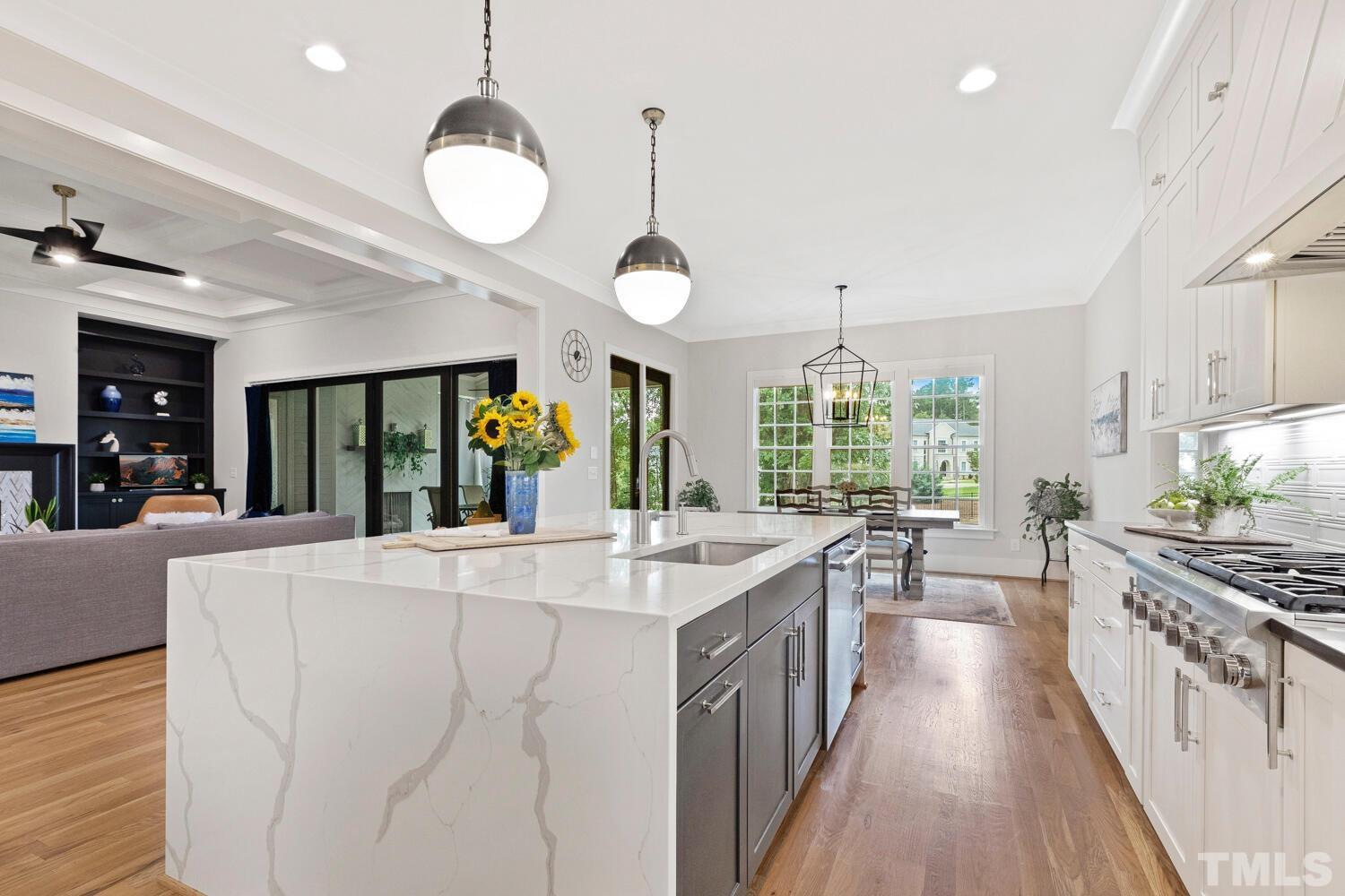 5105 Bella Ridge Drive Raleigh, NC 27615 - Photo 16 of 60 a large kitchen with kitchen island a large island in it