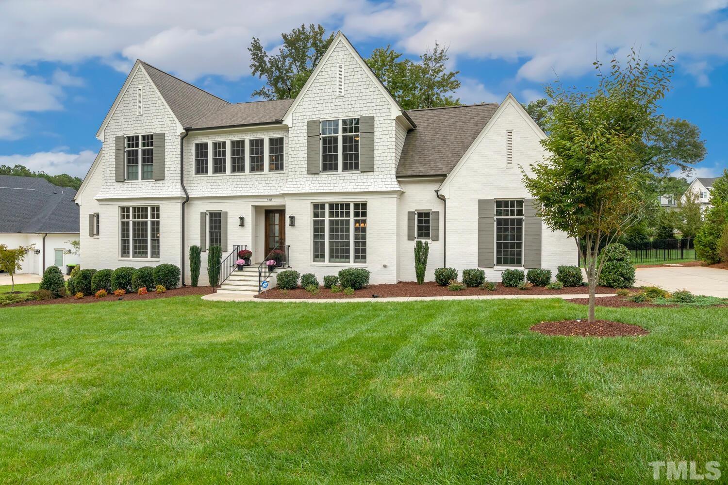 5105 Bella Ridge Drive Raleigh, NC 27615 - Photo 2 of 60 a front view of a house with a yard