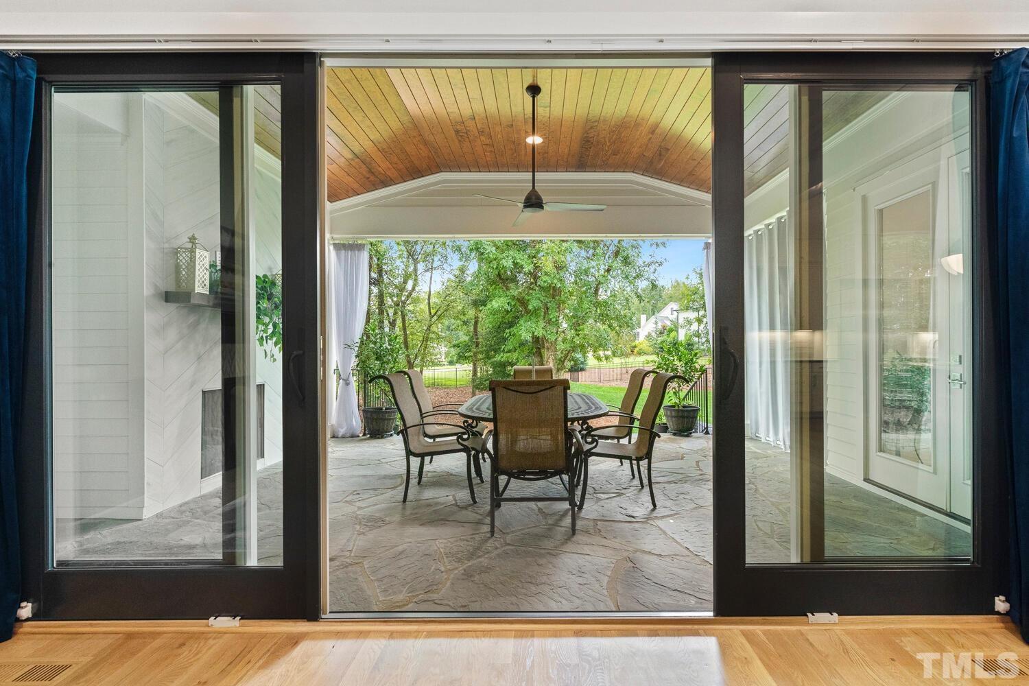 5105 Bella Ridge Drive Raleigh, NC 27615 - Photo 24 of 60 a dining room with hardwood floor and a large window