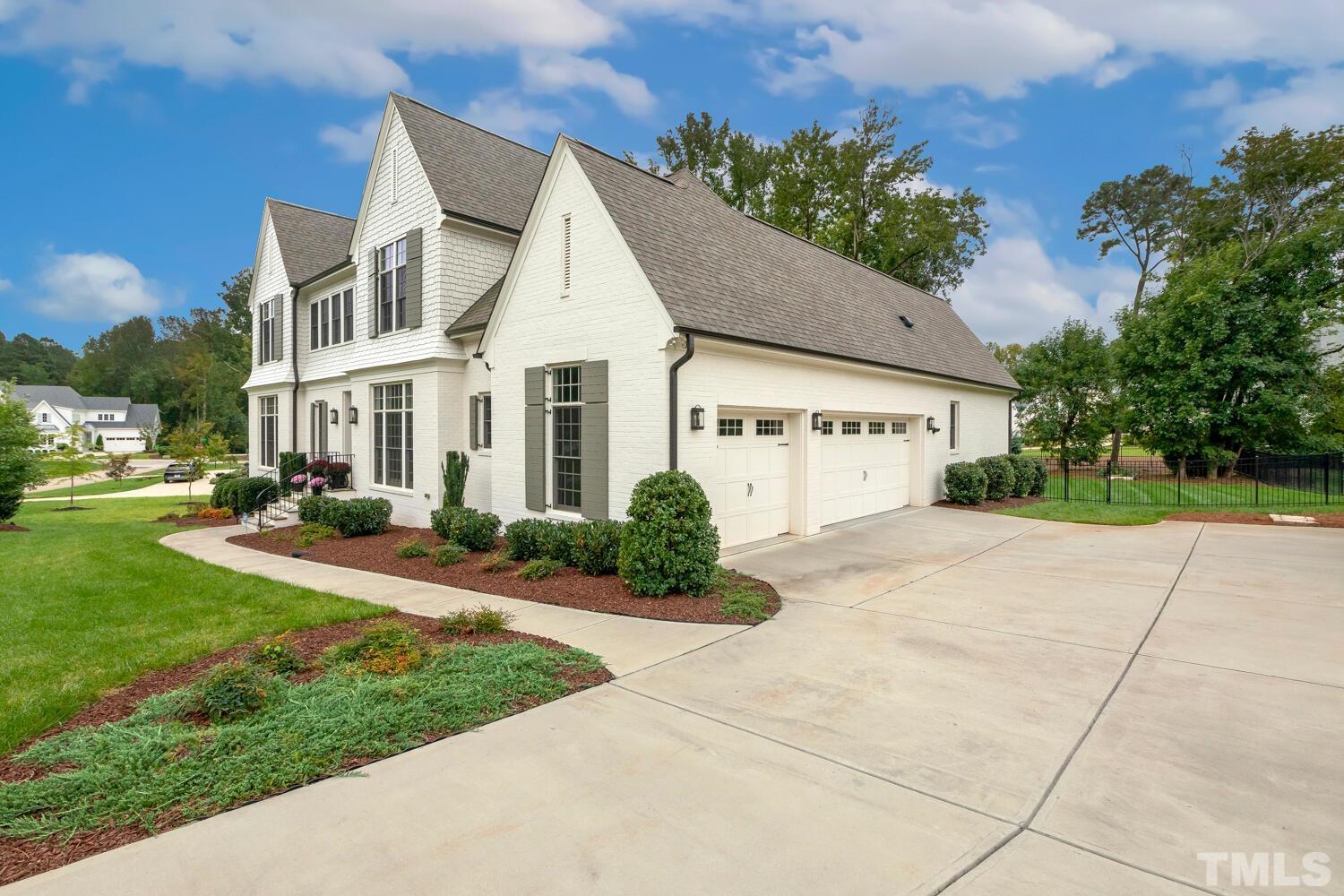 5105 Bella Ridge Drive Raleigh, NC 27615 - Photo 3 of 60 a view of a white house with a yard