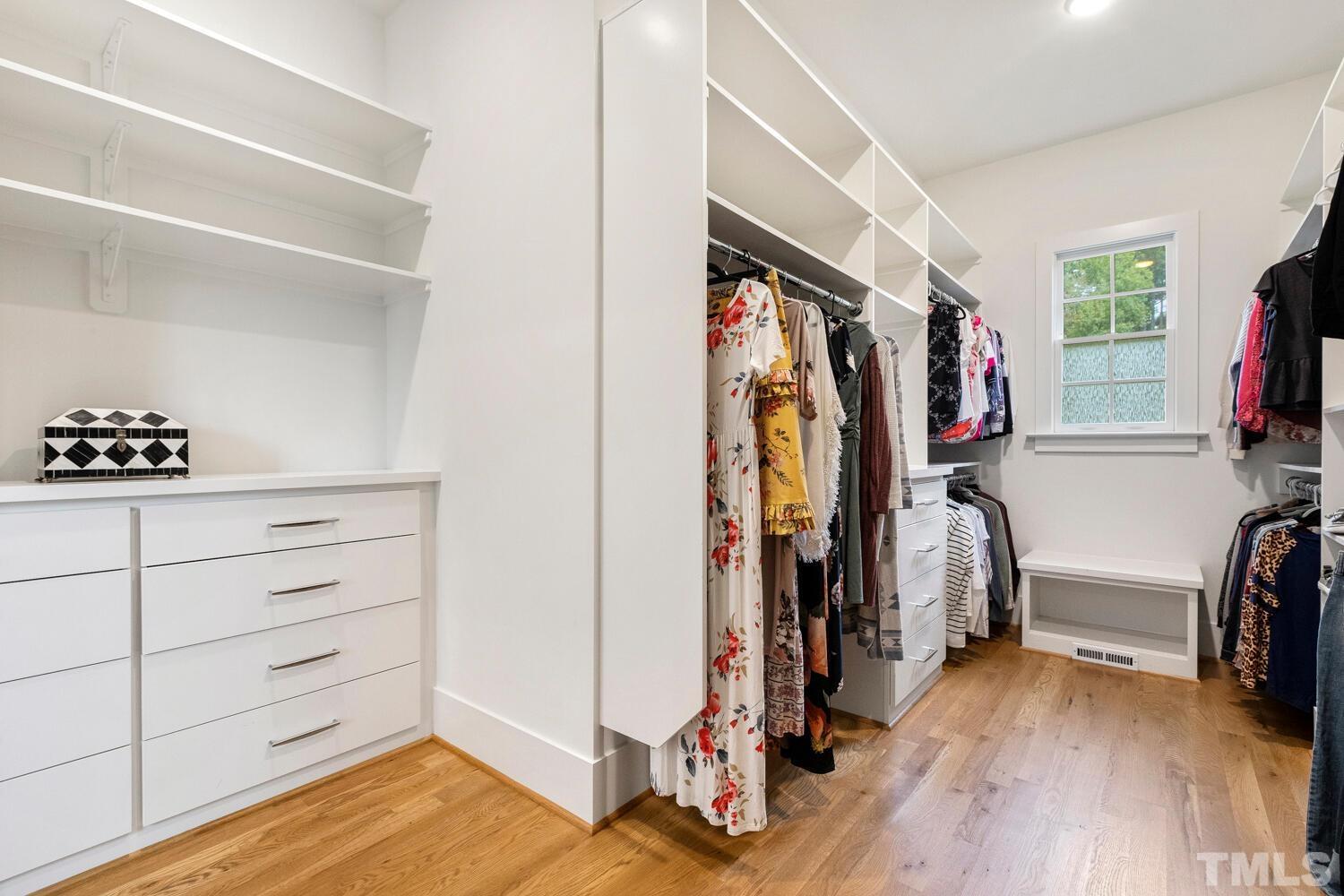 5105 Bella Ridge Drive Raleigh, NC 27615 - Photo 31 of 60 a view of walk in closet with clothes and shoes