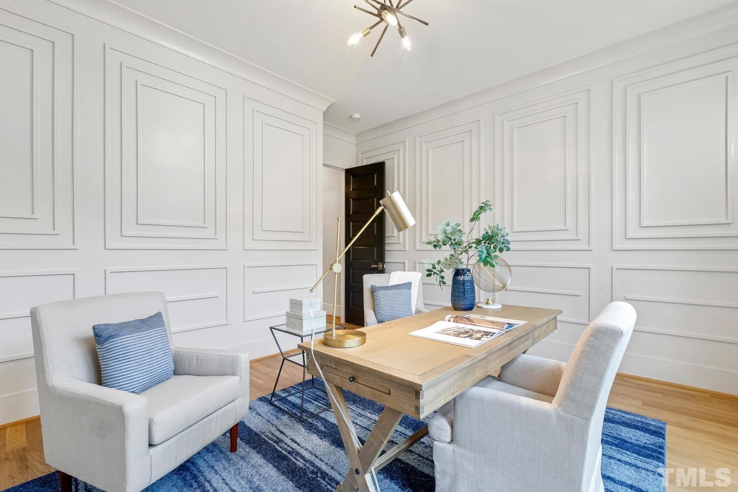 5105 Bella Ridge Drive Raleigh, NC 27615 - Photo 34 of 60 a living room with furniture a table and a potted plant