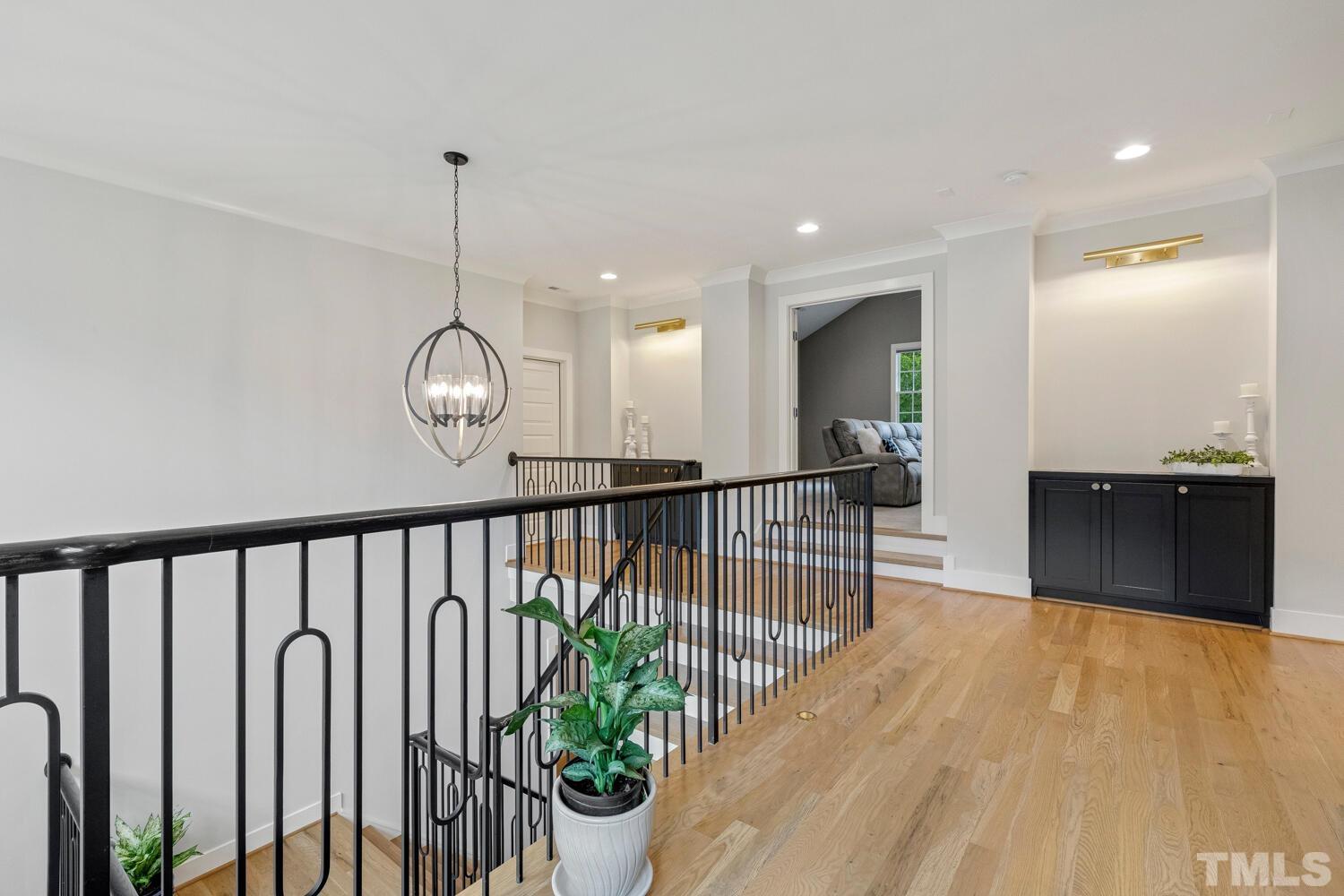 5105 Bella Ridge Drive Raleigh, NC 27615 - Photo 41 of 60 a view of a hallway with wooden floor