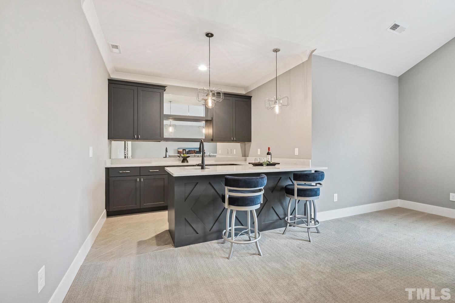 5105 Bella Ridge Drive Raleigh, NC 27615 - Photo 44 of 60 a kitchen with a sink cabinets and wooden floor