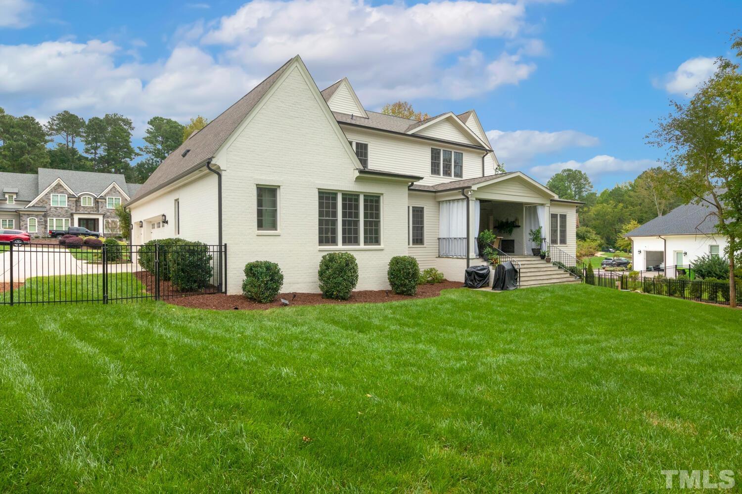 5105 Bella Ridge Drive Raleigh, NC 27615 - Photo 52 of 60 a front view of a house with a garden