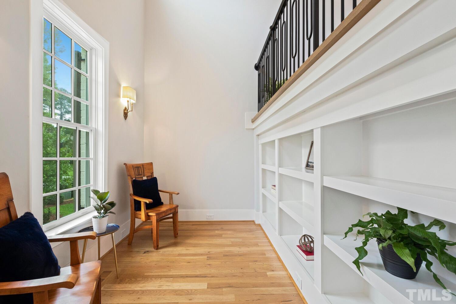 5105 Bella Ridge Drive Raleigh, NC 27615 - Photo 7 of 60 a view of a room with wooden floor and windows