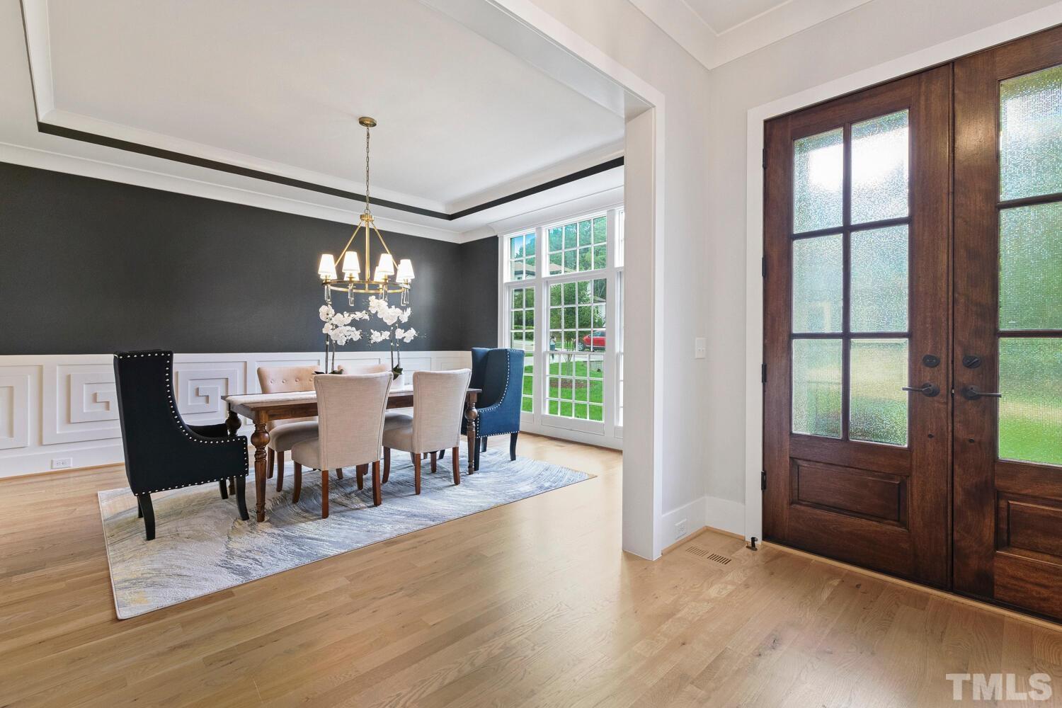 5105 Bella Ridge Drive Raleigh, NC 27615 - Photo 8 of 60 a view of a dining room with furniture window and wooden floor
