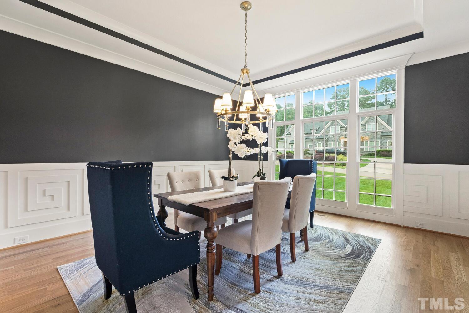 5105 Bella Ridge Drive Raleigh, NC 27615 - Photo 10 of 60 a view of a dining room with furniture window and wooden floor