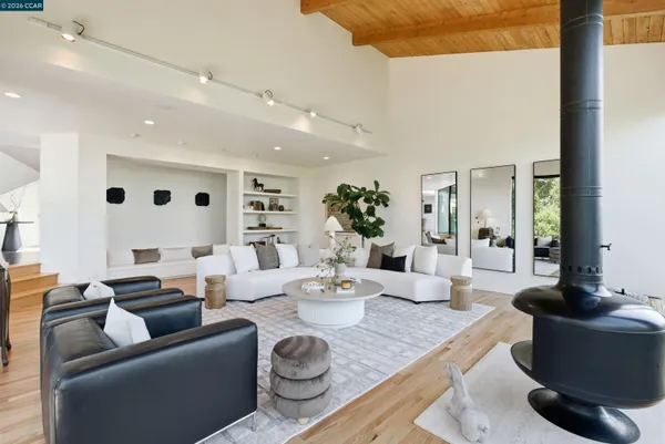 a dining room with furniture and wooden floor