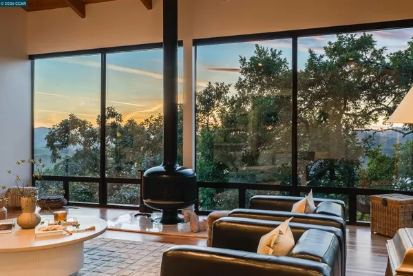 a kitchen with stainless steel appliances kitchen island granite countertop a refrigerator stove and sink