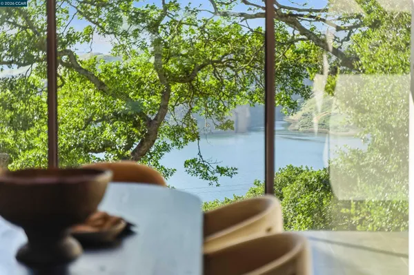 a living room with furniture and garden view