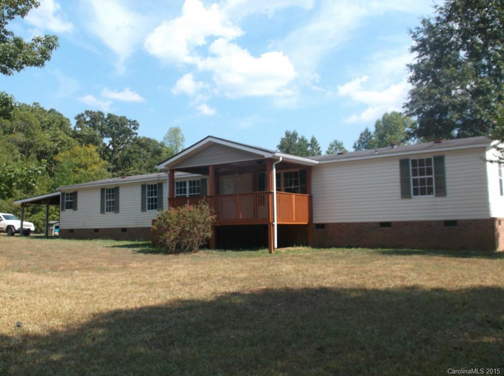 1264 Raxter Road Edgemoor, SC 29712 - Photo 1 of 21 a front view of house with yard and trees in the background