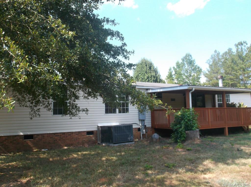 1264 Raxter Road Edgemoor, SC 29712 - Photo 2 of 21 a view of backyard with wooden fence and large trees