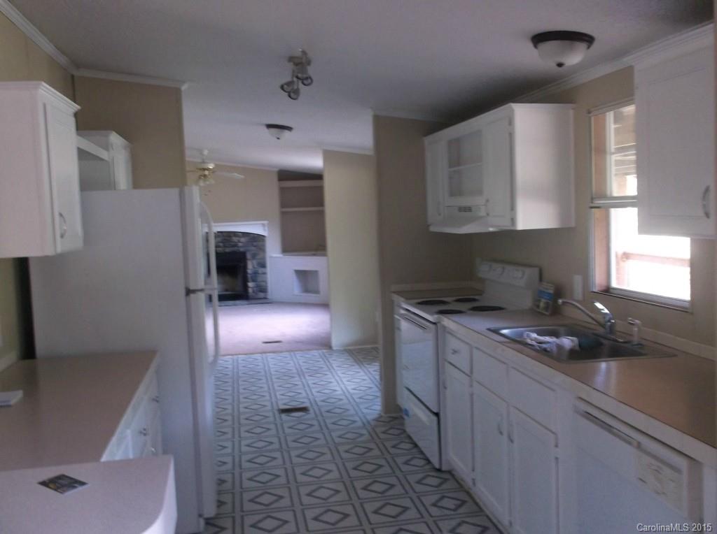 1264 Raxter Road Edgemoor, SC 29712 - Photo 13 of 21 a kitchen with stainless steel appliances granite countertop a sink and a stove