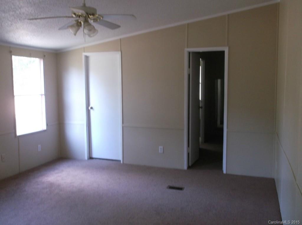 1264 Raxter Road Edgemoor, SC 29712 - Photo 10 of 21 an empty room with windows and closet