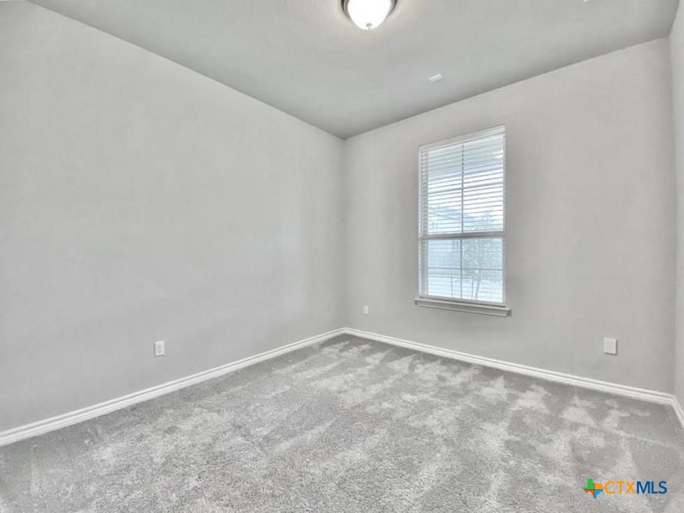 816 Alta Way Leander, TX 78641 - Photo 11 of 37 an empty room with windows