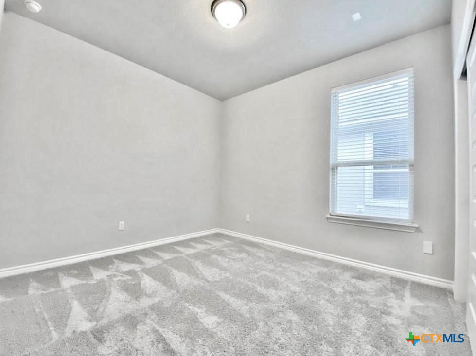 816 Alta Way Leander, TX 78641 - Photo 16 of 37 a view of an empty room with a window