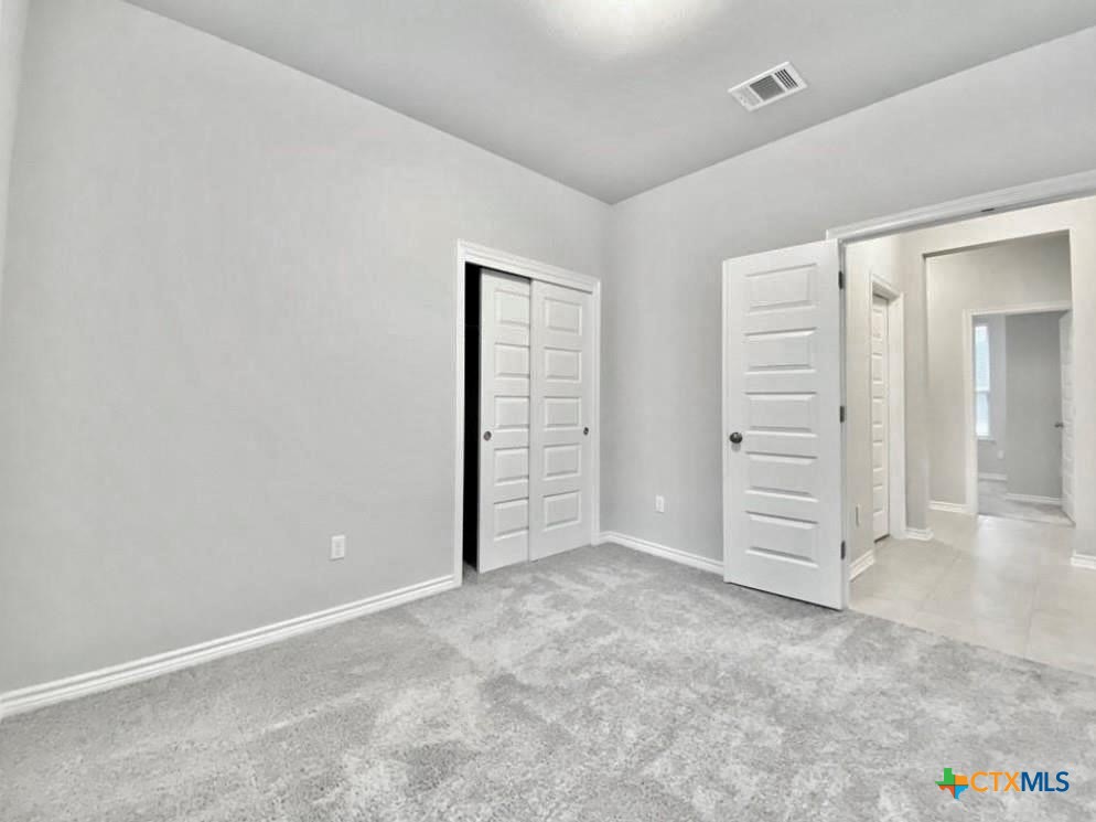 816 Alta Way Leander, TX 78641 - Photo 21 of 37 an empty room with closet