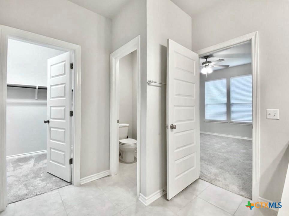 816 Alta Way Leander, TX 78641 - Photo 29 of 37 a bathroom with a shower and a glass door