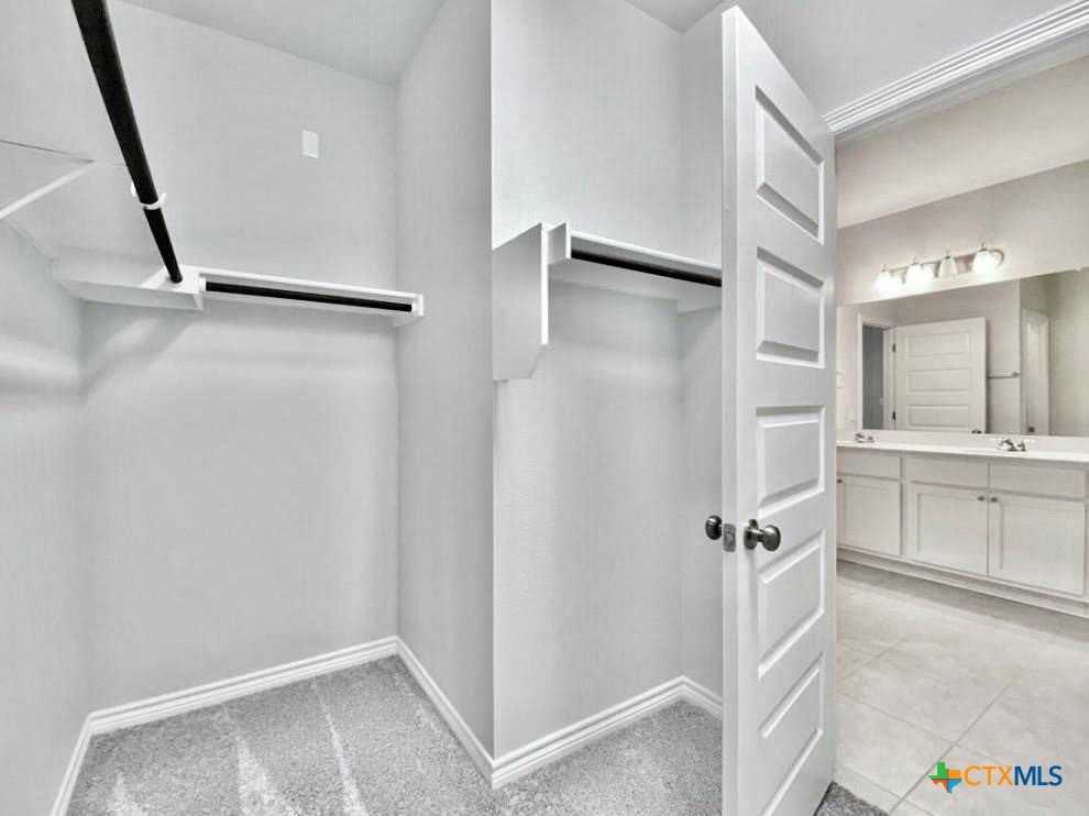 816 Alta Way Leander, TX 78641 - Photo 30 of 37 a bathroom with a shower and a sink