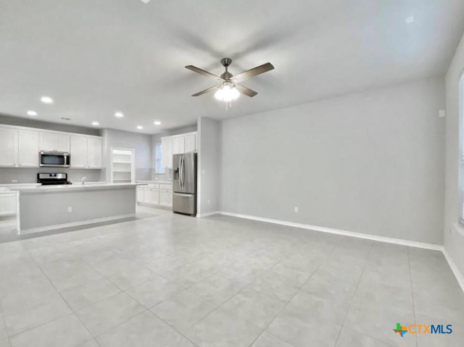 816 Alta Way Leander, TX 78641 - Photo 3 of 37 a view of kitchen with refrigerator and window