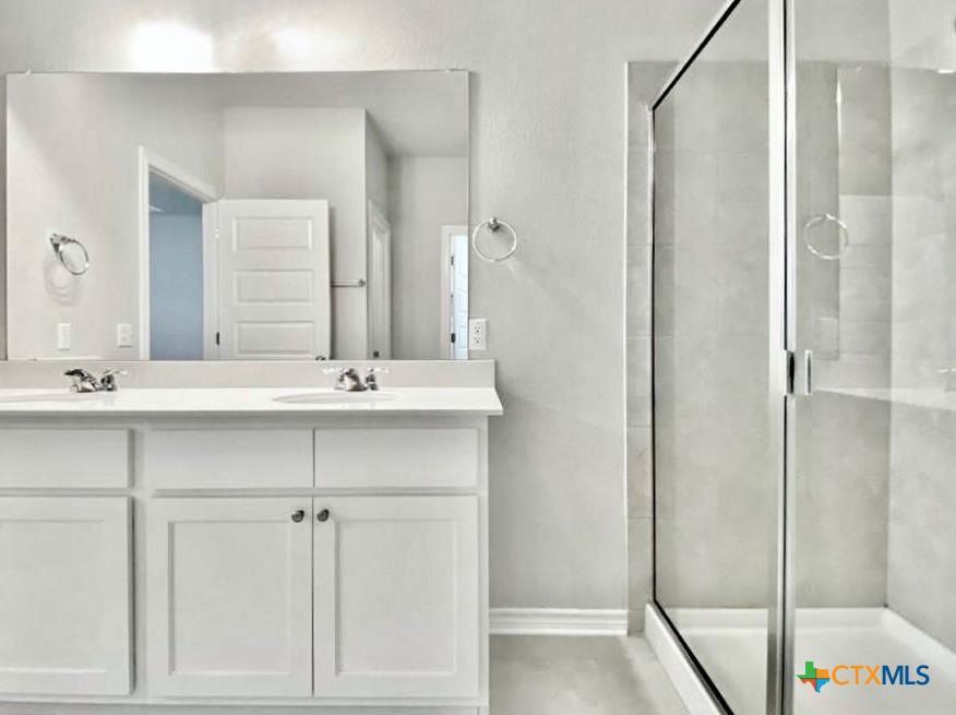 816 Alta Way Leander, TX 78641 - Photo 33 of 37 a bathroom with a sink and a mirror