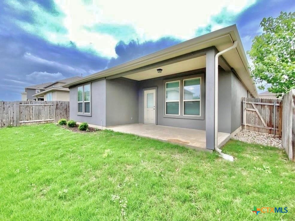 816 Alta Way Leander, TX 78641 - Photo 36 of 37 a backyard of a house with lots of green space