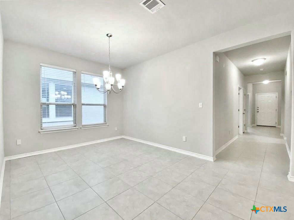 816 Alta Way Leander, TX 78641 - Photo 6 of 37 a view of an empty room with a window