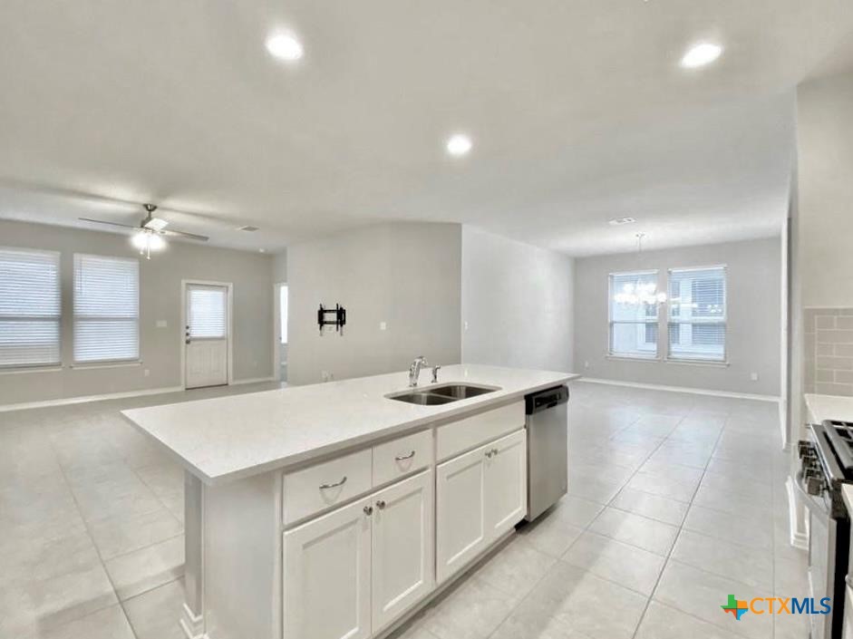 816 Alta Way Leander, TX 78641 - Photo 8 of 37 a spacious bathroom with a granite countertop sink a mirror and a