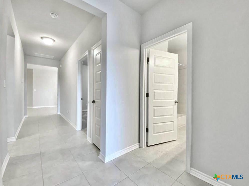 816 Alta Way Leander, TX 78641 - Photo 10 of 37 a view of a hallway to rooms