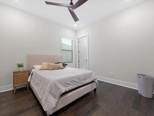 an aerial view of residential houses with outdoor space and lake view