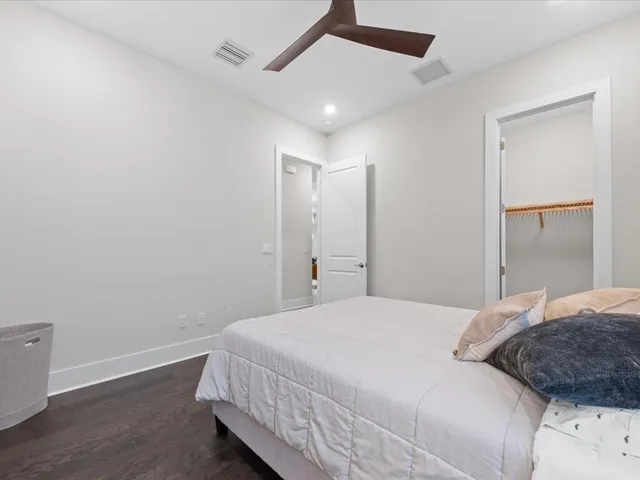 an aerial view of residential houses with outdoor space and river