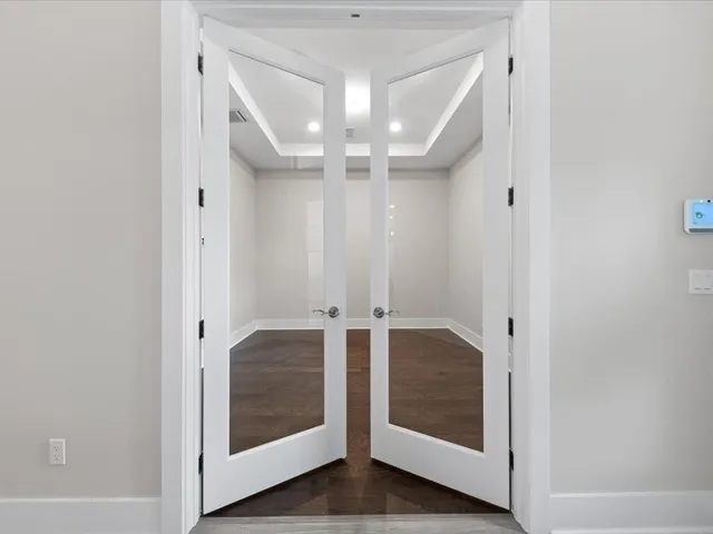 a kitchen with stainless steel appliances granite countertop a sink a stove and a refrigerator