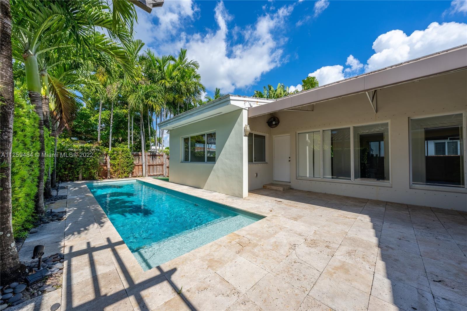 8810 Dickens Avenue Surfside, FL 33154 - Photo 12 of 15 a view of a backyard with a patio