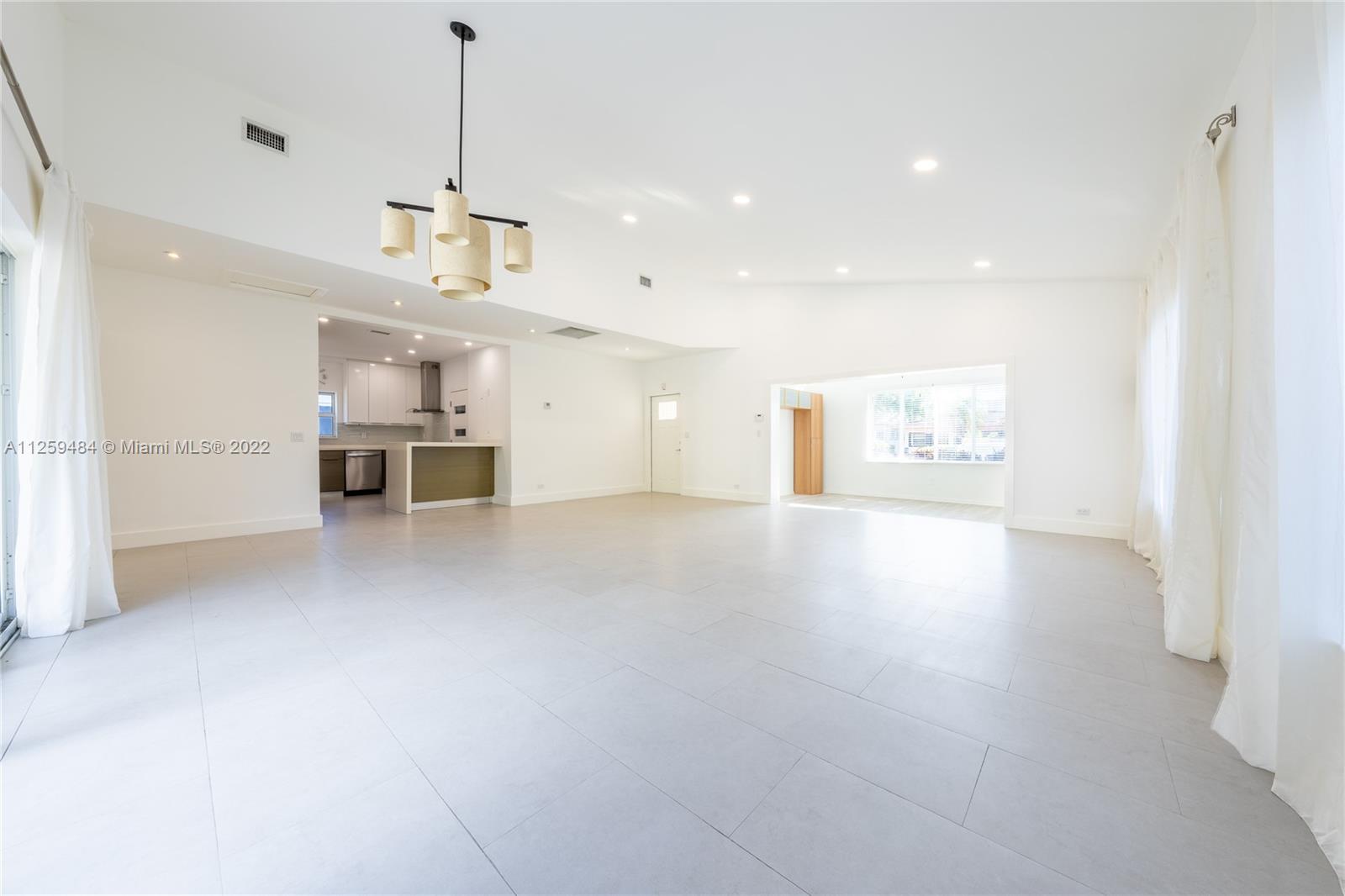 8810 Dickens Avenue Surfside, FL 33154 - Photo 3 of 15 a view of a kitchen with a sink and a window