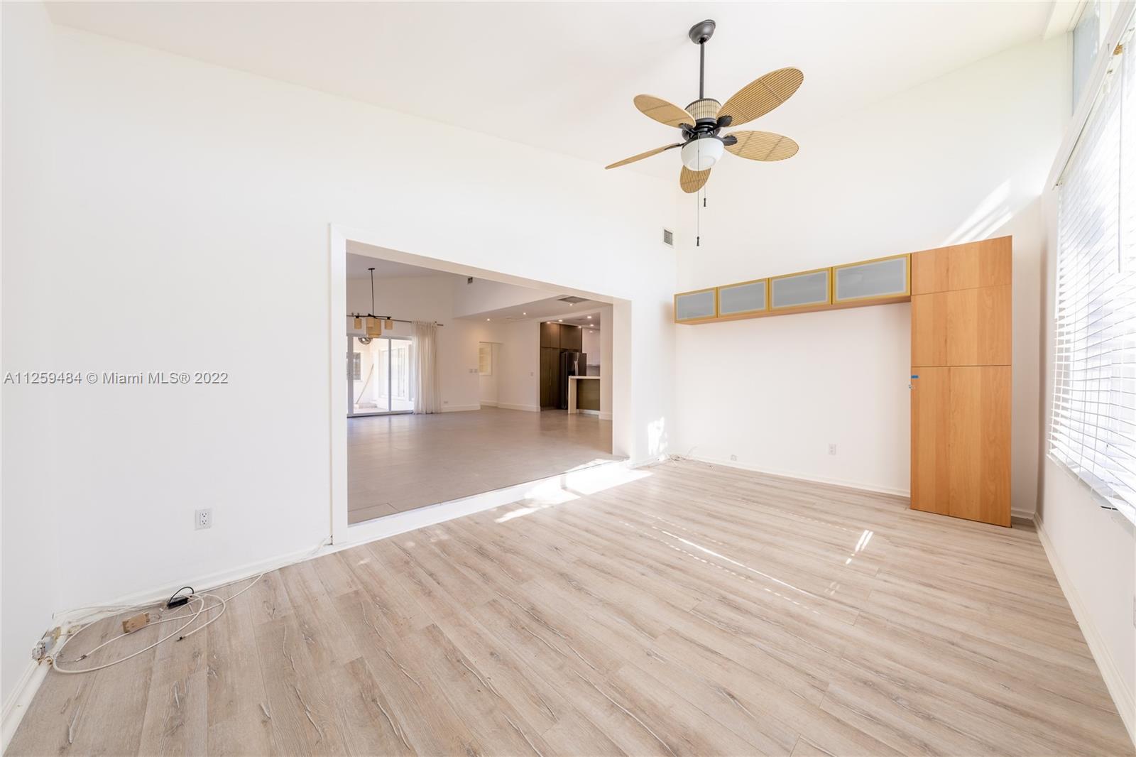 8810 Dickens Avenue Surfside, FL 33154 - Photo 4 of 15 a view of empty room with wooden floor