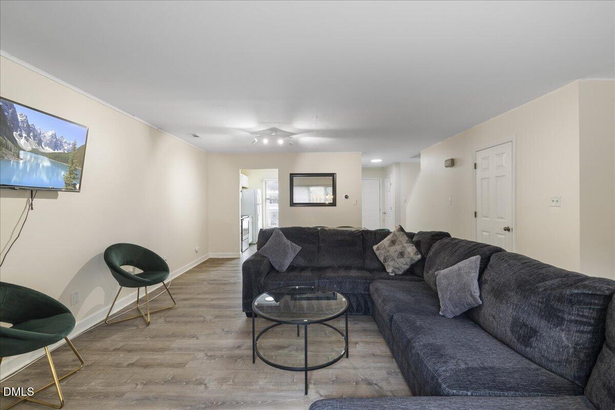 4 Astor Court Durham, NC 27705 - Photo 11 of 29 a living room with furniture and a wooden floor