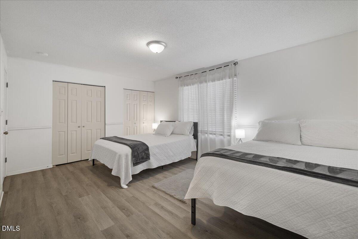 4 Astor Court Durham, NC 27705 - Photo 20 of 29 a bedroom with a bed and a window