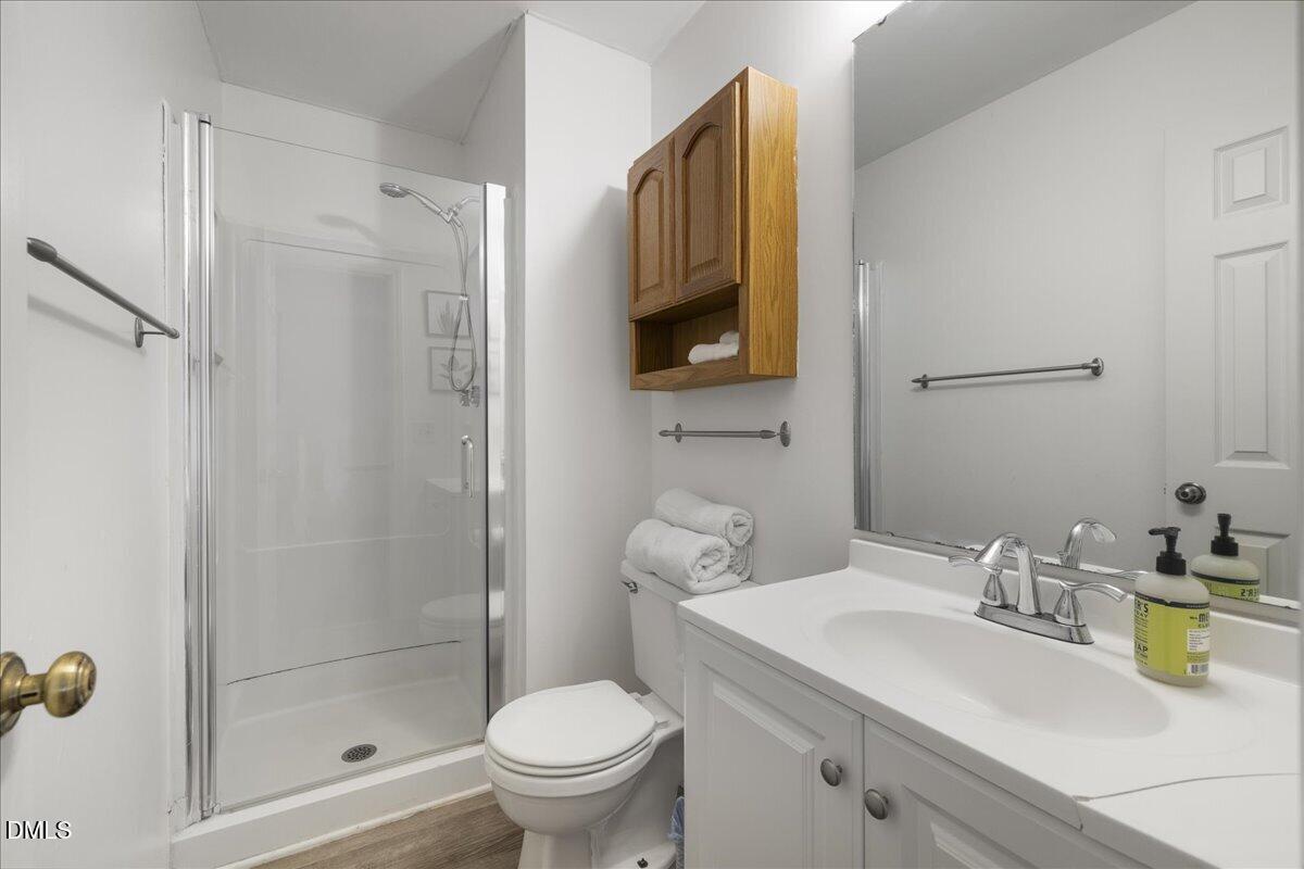 4 Astor Court Durham, NC 27705 - Photo 21 of 29 a bathroom with a sink a toilet and shower