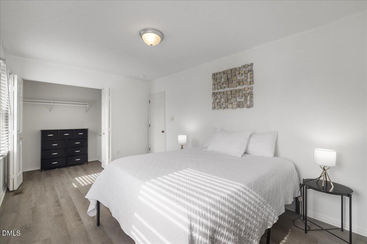 4 Astor Court Durham, NC 27705 - Photo 25 of 29 a bedroom with a bed and a couch