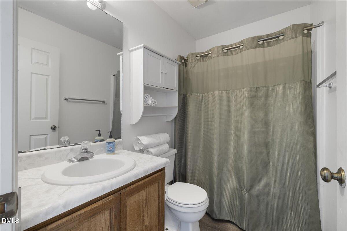4 Astor Court Durham, NC 27705 - Photo 26 of 29 a bathroom with a sink toilet and shower