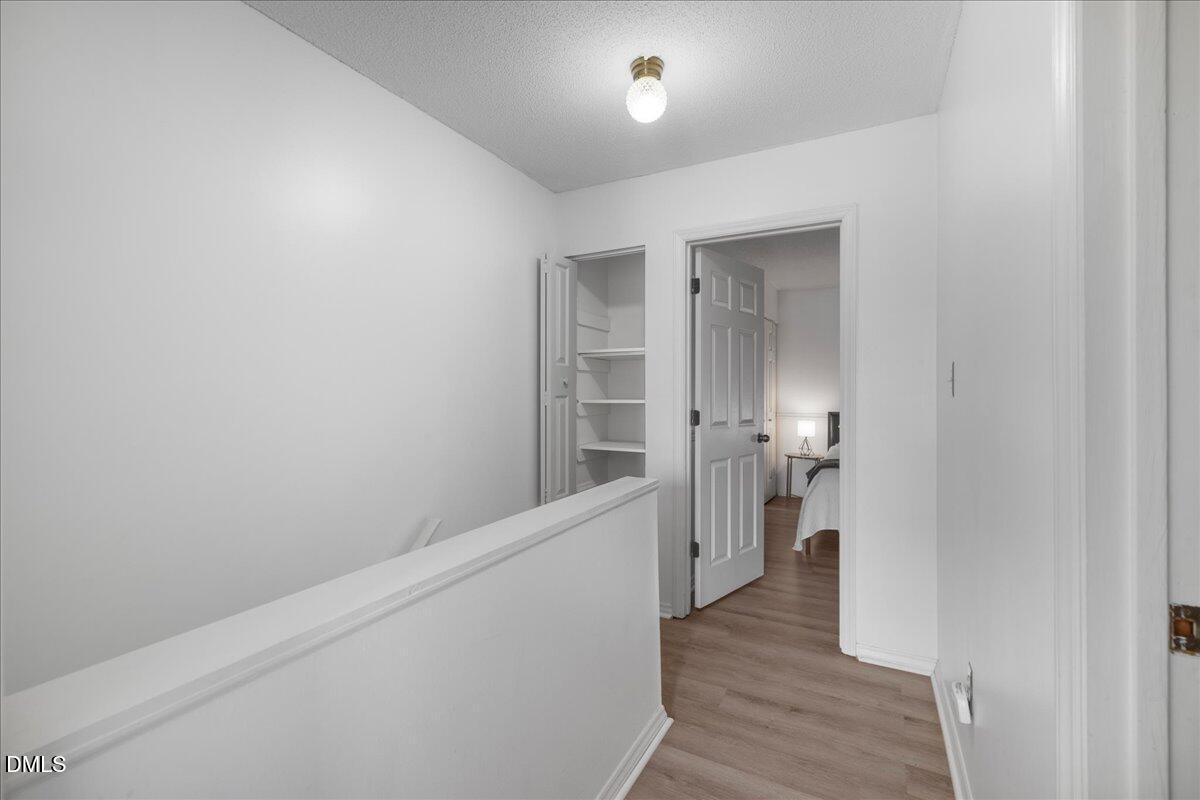 4 Astor Court Durham, NC 27705 - Photo 27 of 29 a view of hallway with wooden floor