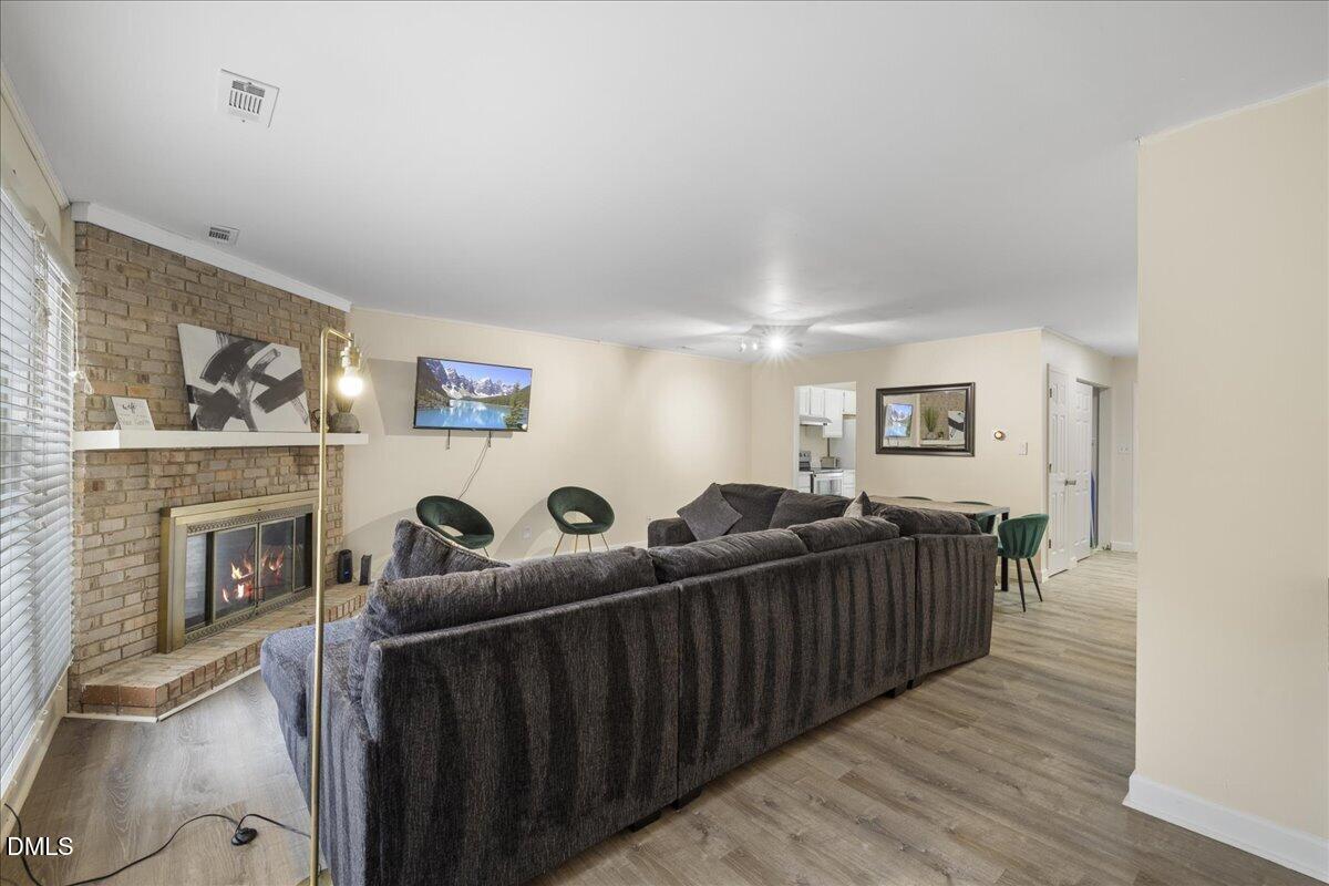 4 Astor Court Durham, NC 27705 - Photo 10 of 29 a living room with furniture and a fireplace