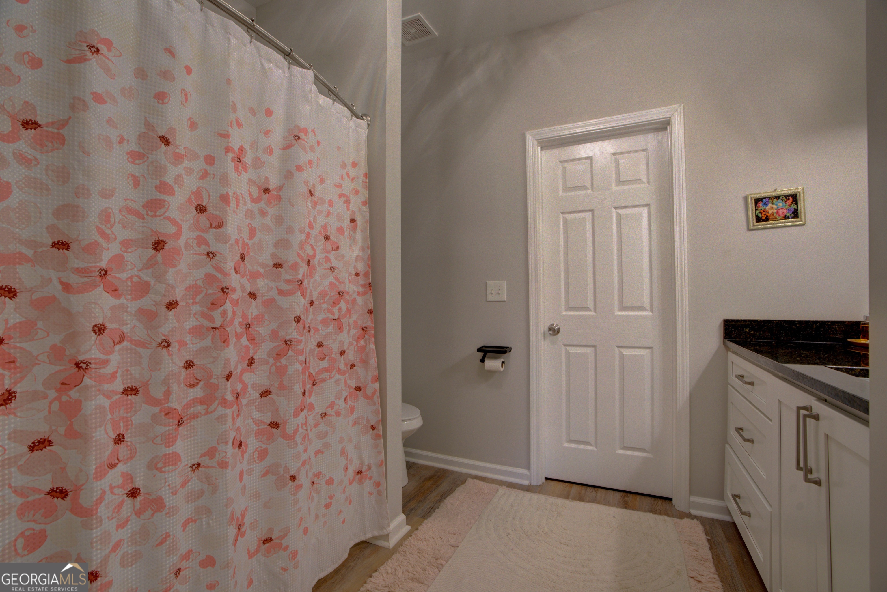 814 Manor Way Cartersville, GA 30120 - Photo 13 of 24 a bathroom with a granite countertop sink and a stove