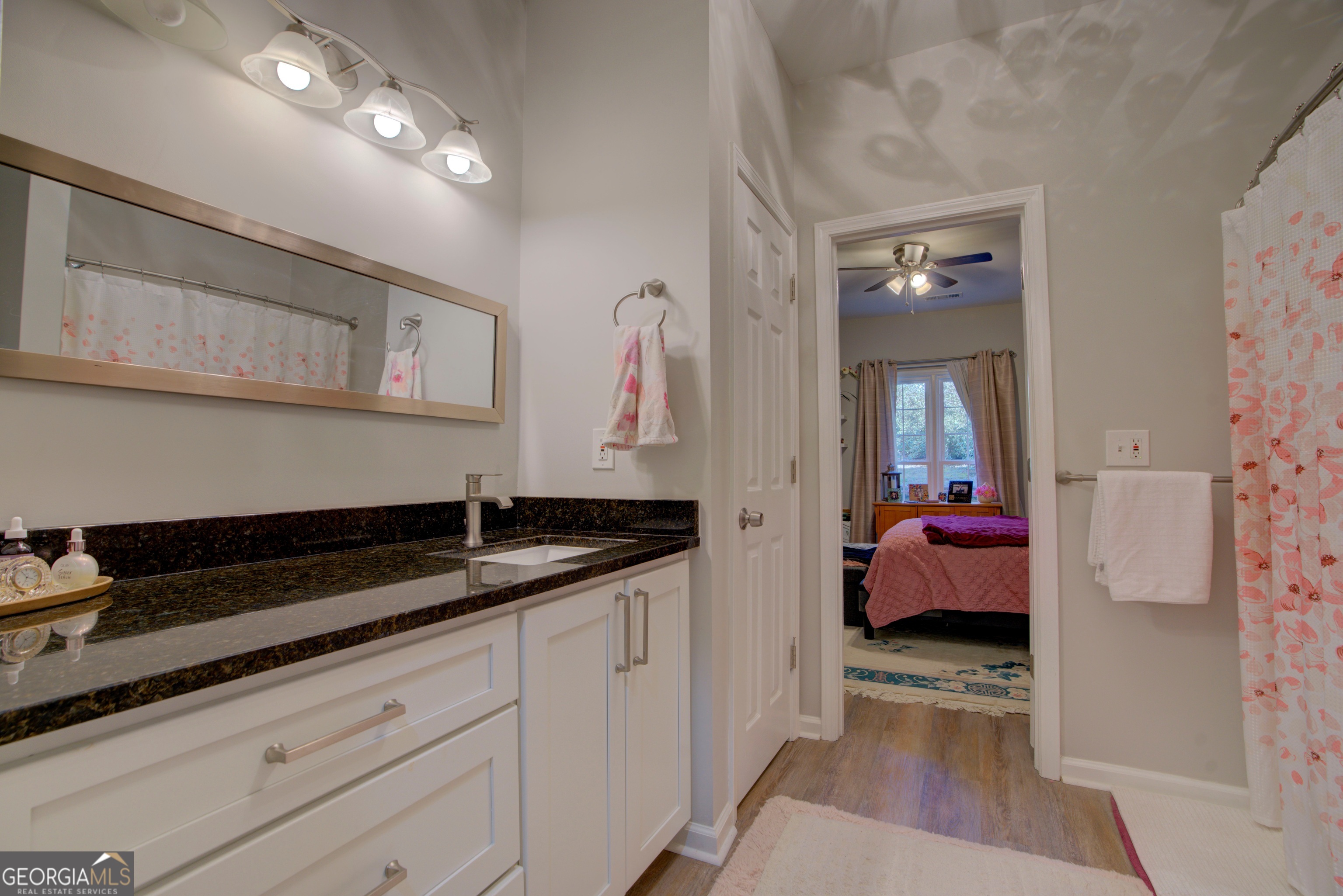 814 Manor Way Cartersville, GA 30120 - Photo 14 of 24 a en suite bathroom with a sink and a mirror