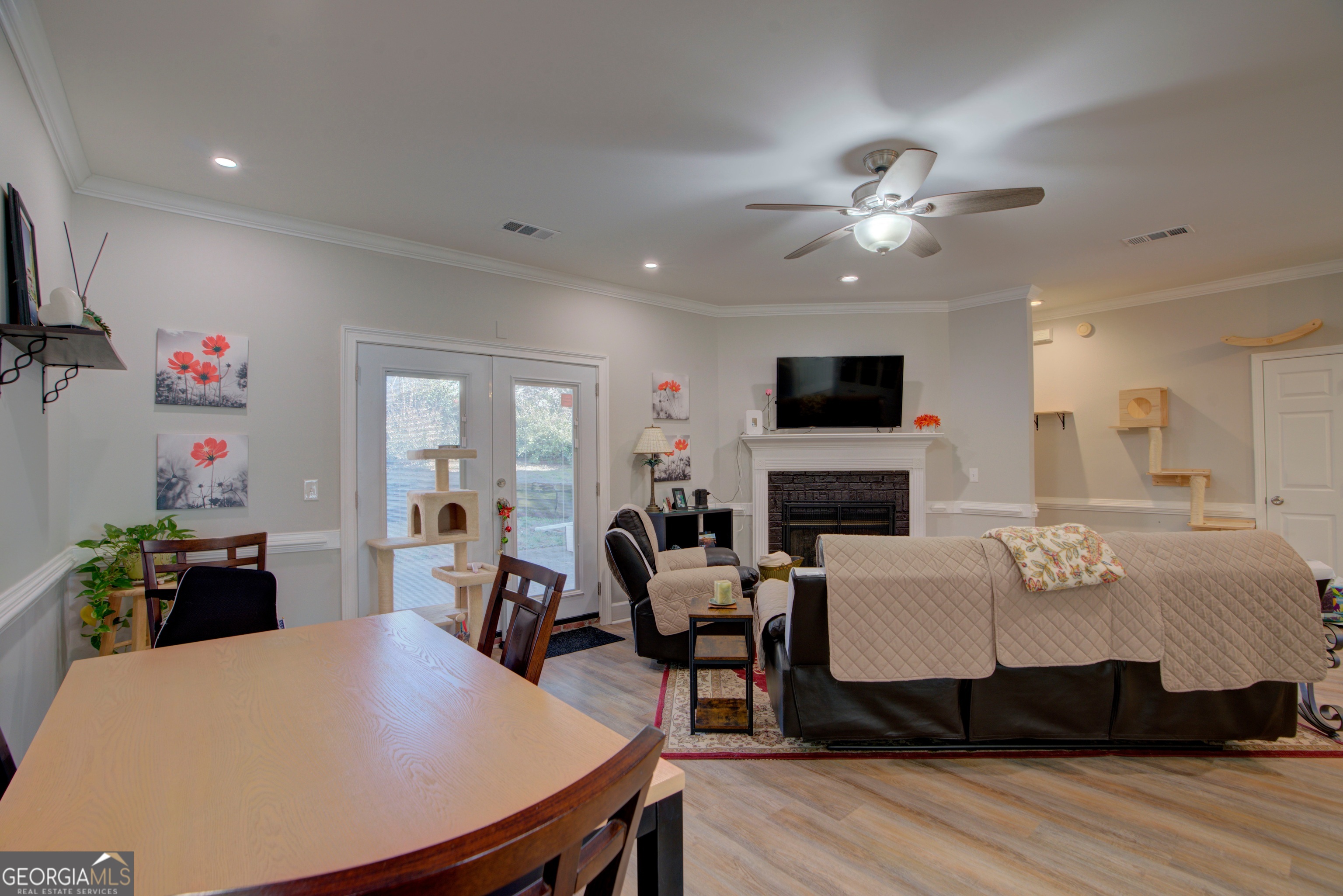 814 Manor Way Cartersville, GA 30120 - Photo 20 of 24 a living room with furniture a fireplace and a flat screen tv